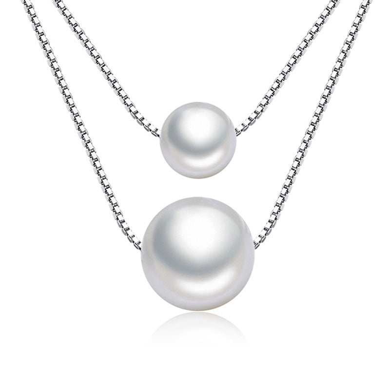 "Korean style double-strand Mother-of-Pearl necklace with adjustable box chain and mother-of-pearl pendant."