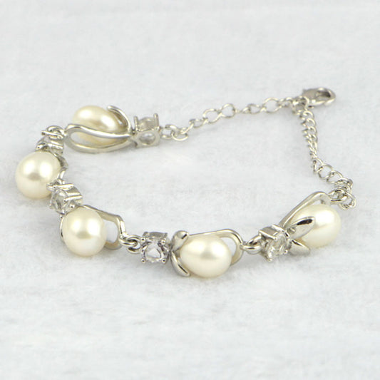 Freshwater Pearl Bracelet-Indulge in elegance with our Freshwater Pearl Bracelet. Handpicked pearls, carefully crafted into a timeless piece of art. The lustrous pearls, known for their calming and balancing properties, make this bracelet not just a stunning accessory but also a meaningful one. Elevate your style and energy with this luxurious bracelet.