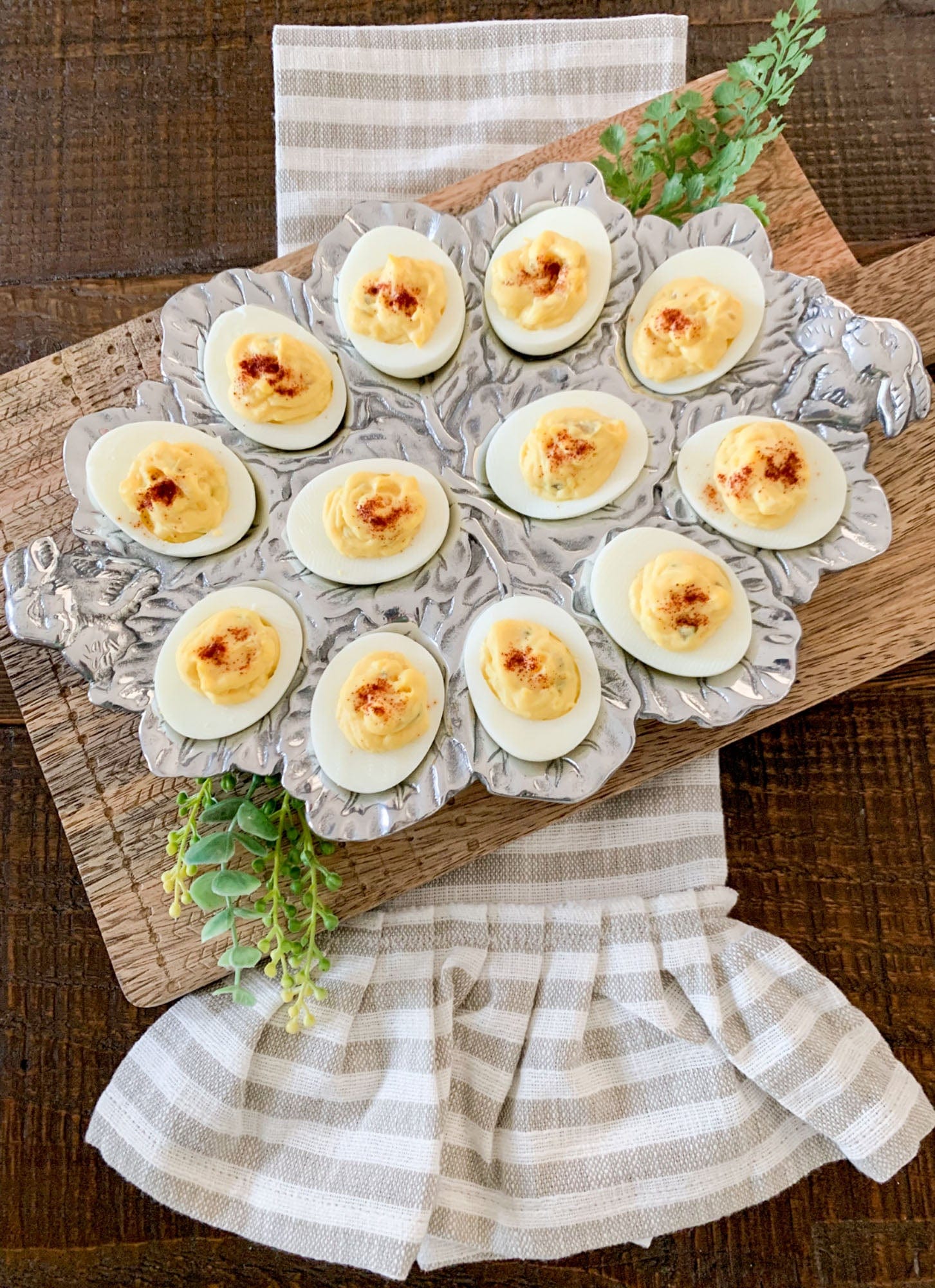 "Bunny Deviled Egg Holder"Add a touch of whimsy to your next brunch with the Bunny Deviled Egg Holder! This adorable holder keeps your deviled eggs secure and adds a charming touch to your table. Perfect for Easter celebrations or any springtime gathering. Hurry, limited stock available!"