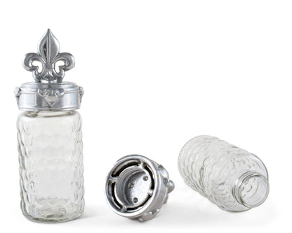 "Fleur-De-Lis Salt and Pepper Set"Spice up your meals with the elegant Fleur-De-Lis Salt and Pepper Set! Featuring the iconic French symbol, this set adds a touch of charm to any dining experience. Its functionality and design make it a must-have for any kitchen or dining room. Add a touch of sophistication to your meals with this unique set"