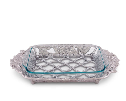 "Magnolia Pyrex Holder 3qt"Unleash your inner chef and elevate your home-cooked meals to perfection with our Glass Baking Dish and beautiful 3-Qt Magnolia Holder from Arthur Court. Your casseroles and lasagnas will be a feast for the senses, baked to perfection every time"